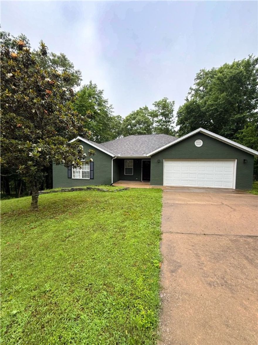 Nestled in the woods and surrounded by nature, this serene 3-bedroom home offers the perfect balance of privacy and convenience. Located just minutes from Lake Ann and Lake Brittany, and approximately 2 miles from the Back 40 trailhead, it's an ideal spot for outdoor enthusiasts and nature lovers alike.
Enjoy a split floor plan for added privacy, with peaceful, wooded views from every window. Whether you're sipping your morning coffee on the deck or exploring the nearby trails and lakes, this Bella Vista gem makes every day feel like a getaway. New garage door opener and 2022 HVAC.Dining room table, bench, and kitchen shelf convey