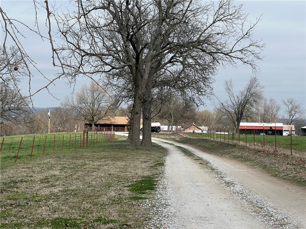 This is an Estate sell with a Home and outbuildings, Barn Fenced and Cross Fenced.corral and live stream on the property the Total acres are 68.97 that is being split off from the current main tract. This was sold prior to print.