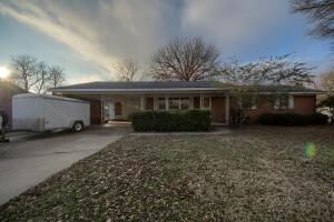 $10,000 upgrade and repair allowance!!! If you're looking for a well-loved, solid home, in a great area... you've just found it! This home sits on a large corner lot on the west side of Russellville, with plenty of storage, 2 car carport , fenced back yard and low maintenance brick exterior! Inside, you'll find 2 large living areas, dining room, large open kitchen and an oversized laundry room with a half bath. Each of the 3 bedrooms have large closets with beautiful wood doors, original wood trim, and hardware. Close to hospitals, shopping, entertainment and schools!