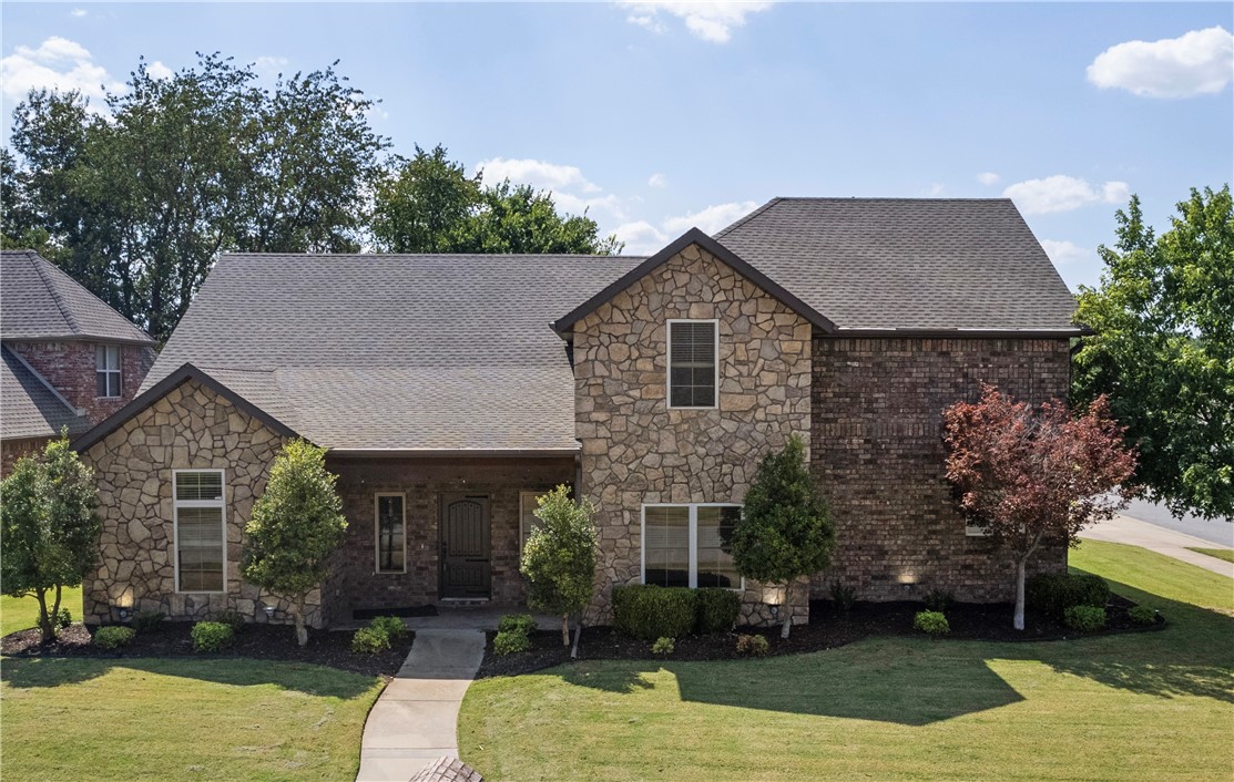 Dreamy location right next to Coler Preserve, this large home comes completely refreshed with new paint and flooring. This East-facing home is stately situated on a manicured corner lot in the center of Windsor Manor subdivision, timeless with its classic brick and stone exterior. Inside, the vaulted ceilings lend grandiosity to the space and the new paint and flooring set off your senses. The dining area is completely open to the living room and kitchen, but with well-defined spaces. The kitchen has beautiful alder cabinets with wine rack feature, a corner pantry, new deluxe double oven, granite countertops, and also a 40" gas cooktop. The primary suite is on the main floor with a private entry under the stairwell. Enter the ensuite bath with large, jetted tub, massive shower, and dream closet. Upstairs you'll find 2 bedrooms with ensuite baths, and a huge bedroom/bonus combo, also with a half bath. The backyard is an oasis with a screened porch including wood fireplace, gas grill, and outdoor sink.