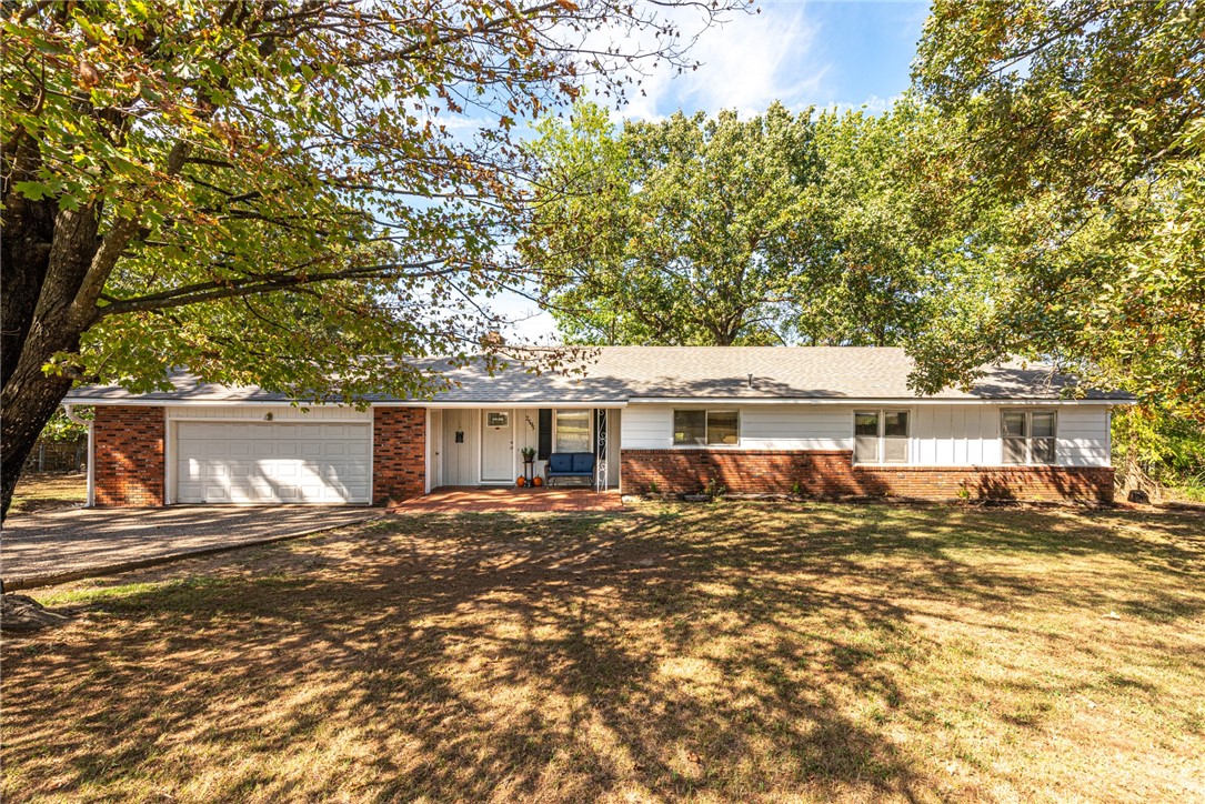Welcome Home! This 3 bedroom 2 bathroom home on 0.7 acres +/- is located right across the street from Gulley Park and is minutes away from University of Arkansas, shopping, and eateries! From the semi-covered front porch with brick detail head inside to the living room with parquet wood floors and wood burning fireplace! Flow into the large dining room with lots of natural light, crown molding, and wainscoting detail. Plus a U-shaped kitchen with lots of cabinetry for stoage, and stainless steel appliances! All three bedrooms feature wood flooring plus 2 full bathrooms! Head out back to the large deck overlooking your fenced-in backyard perfect for hosting friends and family. Plus a 7x10 storage shed! Act quick!