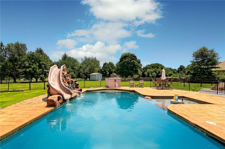 Backyard paradise on one acre.  Saltwater pool with slide, waterfall and heater.  Extensive covered patio, sundeck and yard.  Home has gated access to Lost Springs Golf and Athletic Club.  Stately home office with rock fireplace, built-ins and French doors.  Spacious primary bedroom has bay window, large walk-in closets and separate tub and shower.  All bedrooms are downstairs.  Bonus room is only room upstairs.
New roof 2020.