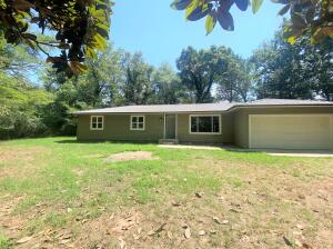 Completely remodeled home nestled on a shady half acre lot in the heart of Atkins. 4 bedrooms, two living areas and bonus room/office space, and 1750sqft of updates throughout. From top to bottom-NEW! New floors, countertops, insulation and sheetrock, plumbing, AC and roof. Park your cars and your hobbies in your 2-car garage perfect for additional storage.