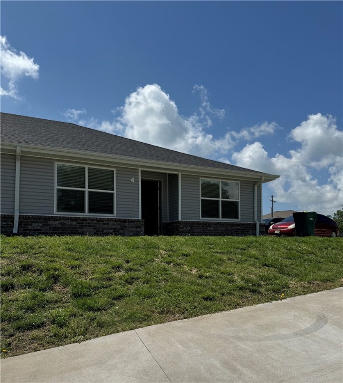 Three-bedroom, two-bath unit with granite countertops, LVP floors, and complete appliance packages that include a washer, dryer, refrigerator, gas range, microwave, and dishwasher with functional layouts. The floor plan is open from the living room to the kitchen. The unit also has blinds and ceiling fans in the living room and the bedrooms.