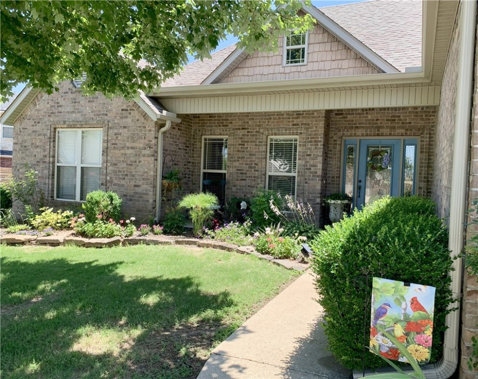 Gorgeous, well-maintained home with vaulted ceilings, crown molding and a spacious split floor plan. The open kitchen features stainless steel appliances, and granite countertops. Upstairs bonus room is perfect for an office, playroom or gym space. Primary bedroom offers a walk-in closet, jetted tub, and separate walk-in shower. Enjoy the privacy-fenced backyard, ideal for relaxing or entertaining with an organic irrigation (automatic) watering system with blackberries. Conveniently located near I-49 & 71B, shopping, schools, and parks. Refrigerator to convey.