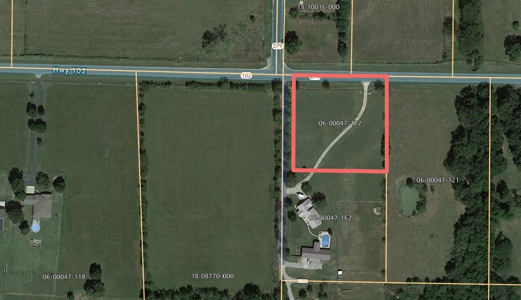 Development opportunity with approx. 300' Hwy 102 frontage. Zoned C-2. Perfect for convenience store, business center, storage facility, etc.