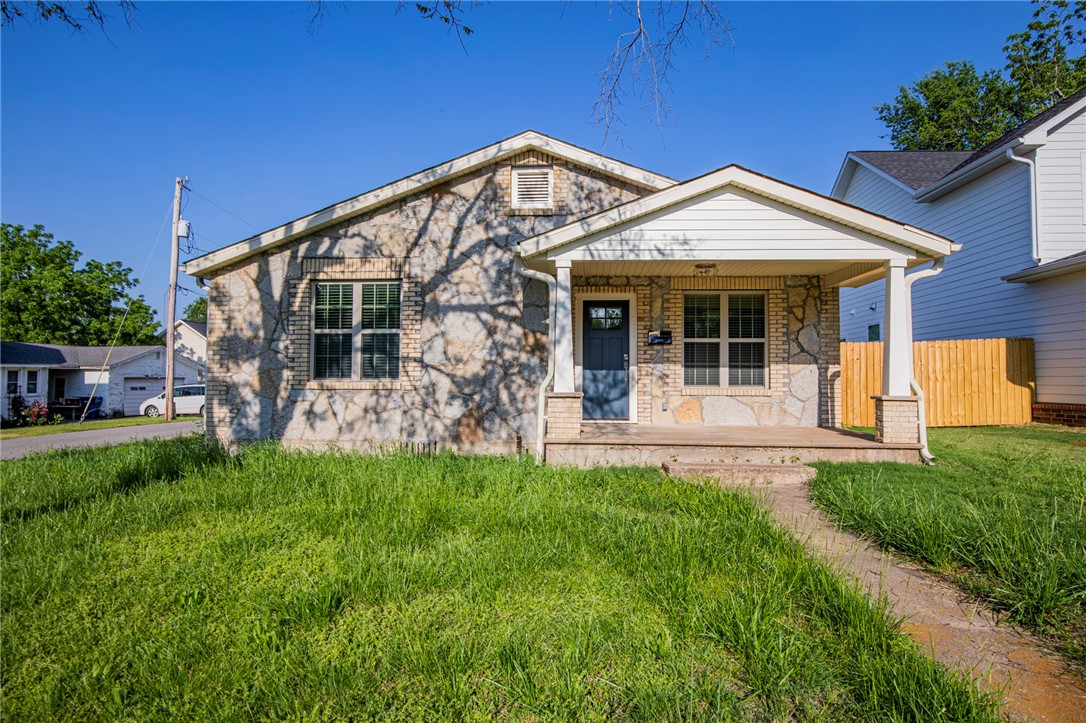 Full of charm and fully remodeled home in downtown Siloam Springs. 3 bedroom 2 full has wood style tile flooring throughout. Kitchen features stainless appliances, granite counters and built in pantry. Bathrooms include granite counters and tile upgrades on tub and shower. Full size washer/dryer included. Great oversized carport with additional storage.