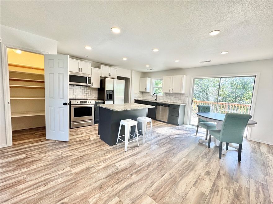 Don't judge a book by the cover - Fully updated (inside) 3BR/2.5BA townhouse with attached 1-car garage. No carpet—LVP flooring throughout. Kitchen features island & pantry. Primary suite has large walk-in closet and private bathroom; spacious closets in all bedrooms. Private laundry room with W/D hookups (W/D available to rent). Half bath downstairs. Large private back deck. Convenient to I-49, Walmart Home Office & Downtown Bentonville Square. Walking distance to schools and neighborhood market. 

Flexible lease terms available for those looking to purchase with pets negotiable with additional fees. Agent owned & managed.