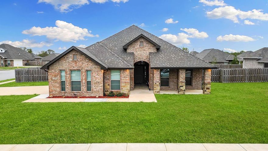 Welcome to Avalon, the first subdivision you'll reach when entering Pea Ridge from Bentonville—one of the most convenient locations in town. This corner-lot home features a spacious side-entry, oversized garage and a bright, open-concept layout perfect for comfortable living and entertaining. With four generously sized bedrooms and three full bathrooms, there’s plenty of room for entertaining. Natural light highlights the wood-look tile floors and granite countertops, while the living room flows seamlessly into the kitchen and dining area with a cozy fireplace. The primary suite includes a large en-suite bath with dual vanities, a soaking tub, step-in shower, and walk-in closet. Enjoy the outdoors from the covered patio and fenced backyard or relax on the front porch and enjoy the neighborhood charm. Don’t miss your chance to own this beautiful home in one of Pea Ridge’s most desirable locations!