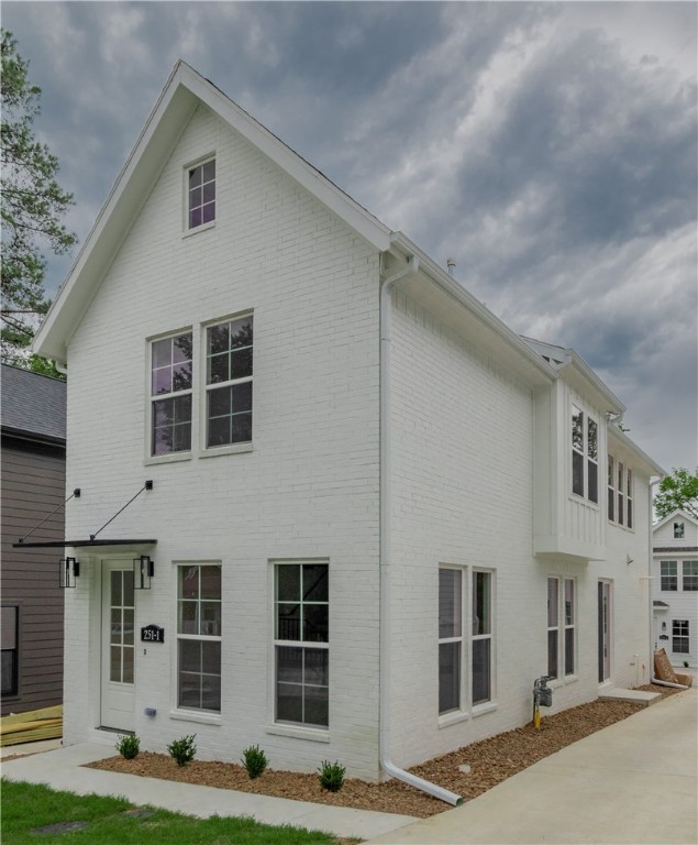 Located just minutes from the University of Arkansas, this brand new all-brick home offers the perfect blend of luxury and convenience in the heart of Fayetteville! Enjoy easy access to the University, Fayetteville Square, Farmers Market, Dickson Street, and all the dining, shopping, biking, and walking trails that Fayetteville has to offer! This stunning home boasts 3 bedrooms, 3.5 baths, and high-end finishes throughout! The open floor plan highlights engineered hardwood floors, a chef-inspired kitchen with a large island, sleek quartz countertops, and a gas range — perfect for entertaining or everyday living. High-end trim, cased windows, and custom-built cabinets that reach to the ceiling add an extra touch of elegance to this already beautiful home. With thoughtful details throughout and a layout designed for comfort and style, this home truly has it all. Photos are of a similar floor plan. The estimated completion date is early to mid-July 2025.