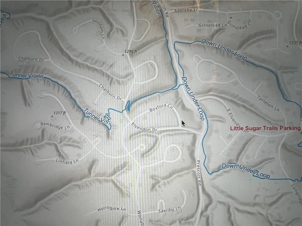 Bike in/out of the Down Under Loop where it intersects with Tunnel Vision! Multiple TrailHeads and Trail Systems in the immediate area! Right off Prescott Road and close to Chelsea Road. Lot has been perced to prove buildability. Contract Concierge Service available to get you through the Permitting Process while you stay in Dream Home Mode! 7 Lakes, 7 Golf Courses, Pickle Ball Courts, Gyms, IN/OUTdoor Swimming Pools, 100's of miles of World Class Mountain Bike Trails, Bentonville Schools and So Much More!