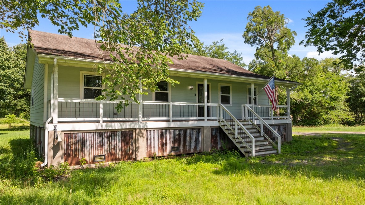 Welcome to 234 N Kibler in Alma, where charm meets convenience on a spacious 1-acre lot! This beautifully updated home features hardwood floors throughout. The kitchen is a standout with floating shelves, butcher block countertops, & a stylish breakfast bar — perfect for casual dining or entertaining. Step outside to enjoy a large backyard deck, ideal for relaxing, grilling, or enjoying the serene Arkansas evenings. Located less than 15 minutes from the stunning Ozark Lake, this property offers the perfect blend of peaceful country living with easy access to outdoor living.