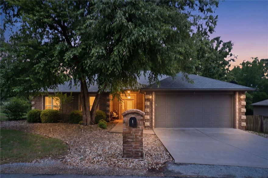Rare one-level home with flat driveway & direct access to the Tunnel Vision Bike Trail in highly desirable Bentonville Schools! This move-in ready home offers freshly painted white interiors, abundant natural light soaring tray ceilings, crown molding, & a spacious open feel throughout. The inviting living room features gorgeous wood flooring plantation shutters, & a stunning stone fireplace perfect for cozy evening at home. The beautifully designed kitchen includes granite countertops, ample cabinetry, pantry storage, & generous prep space ideal for entertaining. Relax in the oversized primary suite w/walk-in shower. Enjoy peaceful mornings & relaxing evenings on the screened-in porch overlooking the level landscaped yard, in-ground sprinkler system. Major updates include architectural roof, remodeled baths, newer HVAC components, updated lighting, fresh paint, newer carpet, water heater, gutters, porch fan & more. Eash living on one level. Conveniently located near Lake Winder, Oz Bike Park, biking trails etc.