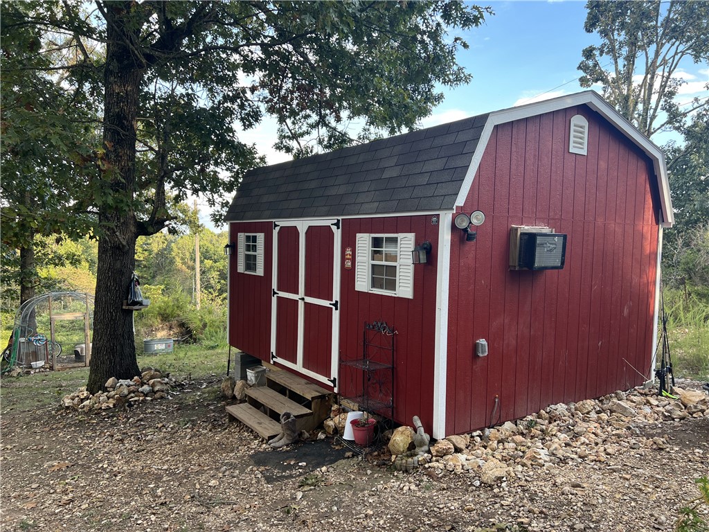 Are you looking for a spot to build a home, park a RV, or place a mobile? This 9.79 Acres M/L property may work for you. The property has a 12ft x 16ft storage building cabin, rural water meter and faucet, electric meter, and septic in place. No Restrictions. The land is mostly in woods and has a great level spot for a home. Come check it out today.