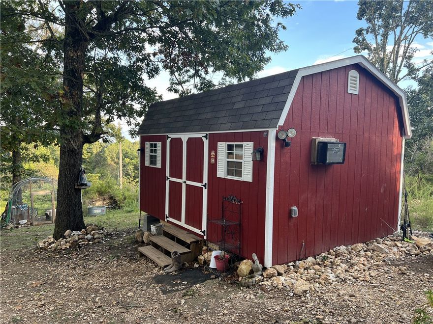 Are you looking for a spot to build a home, park a RV, or place a mobile?  This 9.79 Acres M/L property may work for you.  The property has a 12ft x 16ft storage building cabin, rural water meter and faucet, electric meter, and septic in place. No Restrictions. The land is mostly in woods and has a great level spot for a home. Come check it out today.