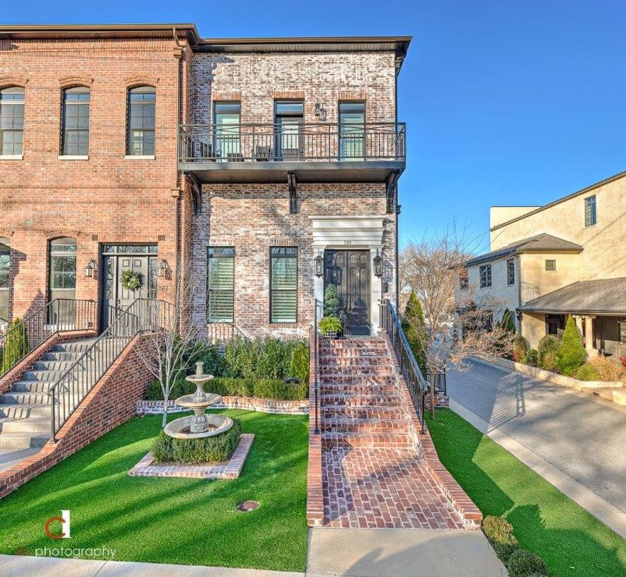 TAKING BACKUP OFFERS!! Please continue to show! CUSTOM-BUILT SHOWSTOPPER IN THE HEART OF BENTONVILLE’S MARKET DISTRICT JUST .7 MILES FROM BENTONVILLE’S CITY SQUARE!!  Located on a corner lot adjacent to the Momentary and across from Baggett Park, this exquisite townhome offers a sleek and elegant style with tons of WOW factors including custom designer light fixtures throughout, plantation shutters, high ceilings, wood and tile flooring throughout, high-end Thermador appliances, low maintenance synthetic turf lawn w/ fountain and professional landscaping, 2 decks/balconies, antique doors & MORE!!  Main level hosts a gorgeous open living room w/ fireplace and custom built-ins while the amazing eat-in kitchen/dining area is located on the second floor and features a private covered balcony w/ gas outlet great for entertaining!  Top floor hosts the beautiful master suite and a guest suite w/ private balcony overlooking the park!  Absolutely PRISTINE…  2 car attached garage w/ epoxy flooring!