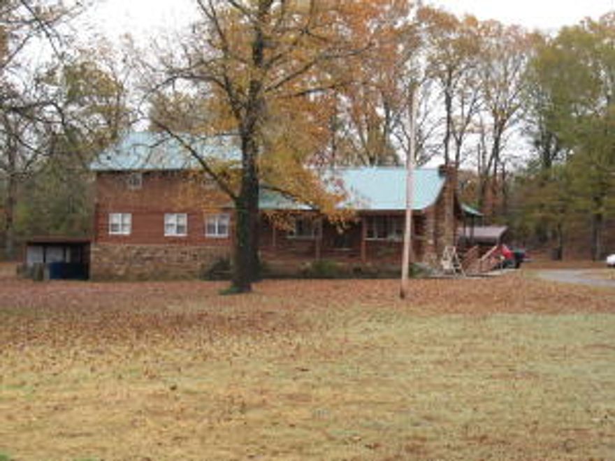 LOOKING FOR YOUR DREAM HOUSE??This beautiful log home retreat offers peaceful tranquility on 38 plus acres adjoining the wildlife management area.You can enjoy fishing on the pond or relaxing in the pool when you are not grilling on the covered back deck.Also includes 2 30x50 shops.
