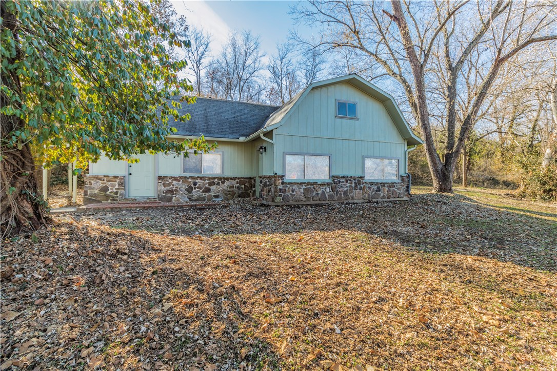 Charming home that has been completely remodeled! Everything has been redone, such as all new electrical & plumbing, new HVAC system, new roof, new water heater, painting, fixtures and flooring. Home provides 4 bedrooms, 3 bathrooms with spacious rooms throughout and formal dining. Has detached garage/workshop. Home is nestled on over 5 acres with a barn and mature trees throughout. Visit the White River just across the highway, and within walking distance of Pig Trail Cafe. This home is adorable and ready for you to move-in. Was under contract, buy fell out due to buyer financing. Come see this one today!