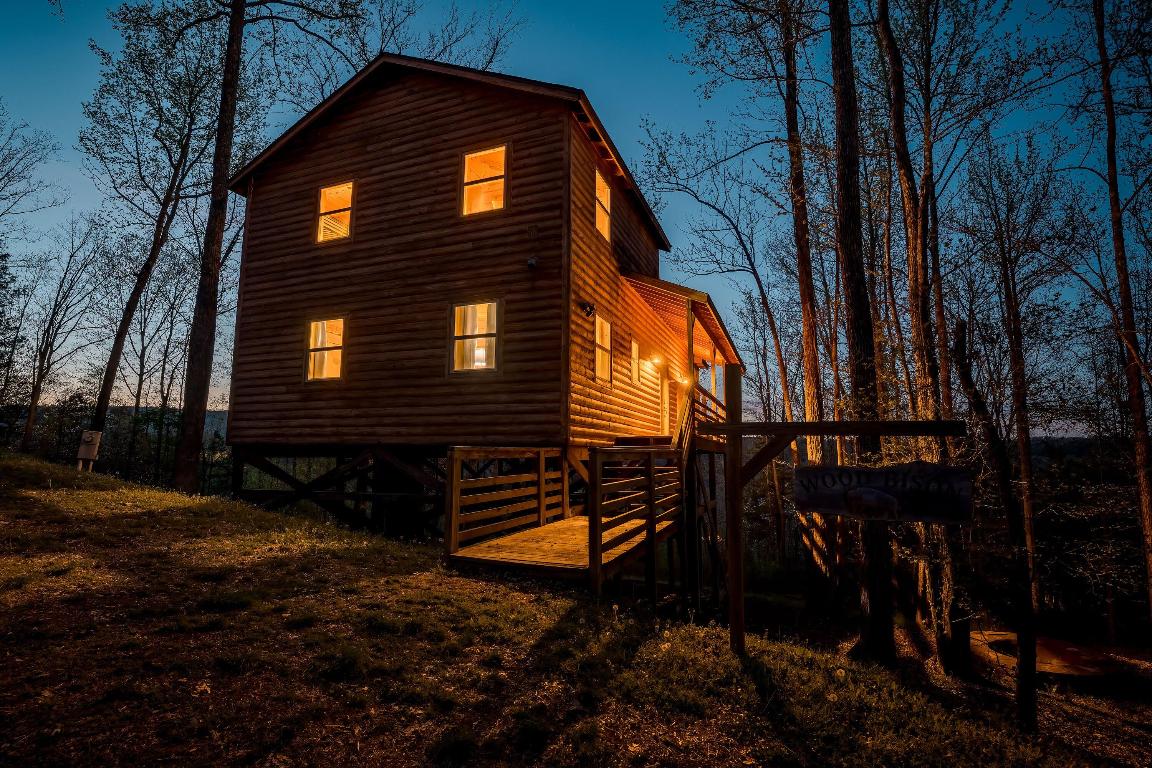 Five gorgeous tree house style cabins w/23.73 acres. Located less than one mile outside of Jasper with a total of 7,104 sf of rental or living space and over 1,685 sf of covered wood decks and porches. These cabins are built on open piers and are referred to as 'tree house' style cabins since they are built from 5 feet to about 20 feet off of the ground which allows for views from the tree level. The property offers nice views with seasonal views of the Little Buffalo River and has Spider Creek frontage. Cape Buffalo Cabin 1,728sf 5BR 2.5BA, Wood Bison Cabin 1,344sf 3BR 1.5BA, Water Buffalo Cabin 1,344sf 3BR 1.5BA, Plains Buffalo Cabin 1,344sf 3BR 1.5BA, American Buffalo Cabin 1,344sf 3BR 1.5 BA. (See supplement for additional details). Great investment potential or family retreat.