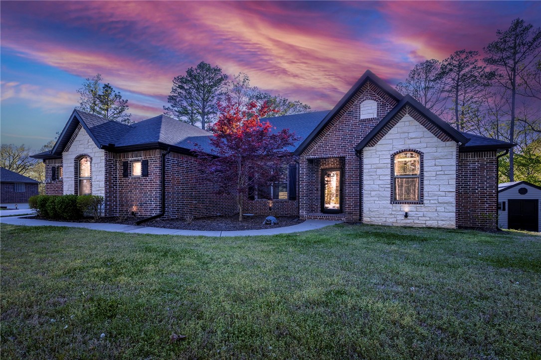 Nestled in a nature lover, hiker, or mountain biker's paradise, this property is just under 1.25 acres (4 connected lots) with 2417 square feet of well-maintained one level living space. Perfectly situated just one mile off 71 and steps away from the Buckingham Trailhead of the Back 40 - offering both convenience and privacy. Just minutes away from Metfield Recreational Complex. The quarter circle level driveway leads to an oversized two-car garage and separate single car garage. Inside you'll find an open living area with 10 ft ceilings, crown molding, guest bathroom, granite counters, a large single sink in the kitchen, laundry room off the master closet with a folding area, split floor plan with bathroom between the 2nd and 3rd bedrooms, plus an office or 4th bedroom (home has a 4 bedroom septic). Relax on your large private covered porch overlooking the woods or entertain on your 1/3rd of an acre sodded side yard which is perfect for outdoor games. Home also has a custom built 12x12 shed for plenty of storage.