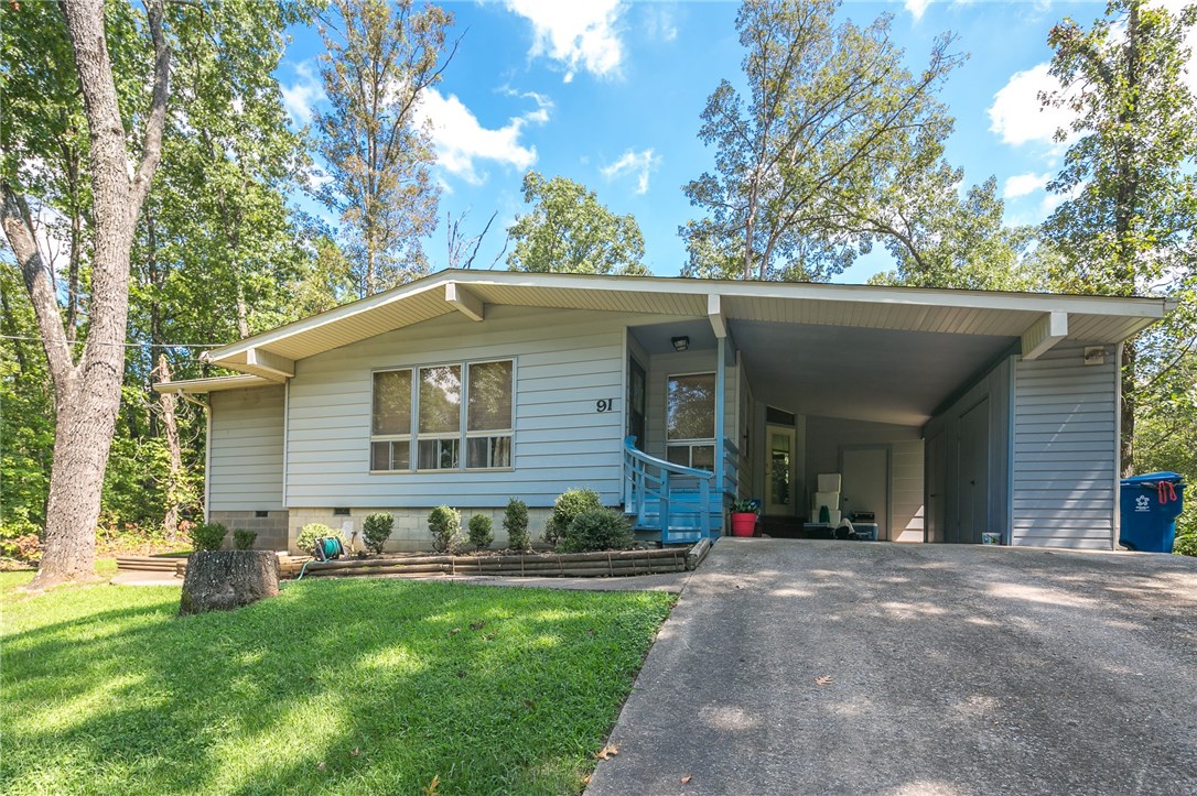 1255 SQ, FT home located in the heart of Bella Vista near Lake Ann & back 40 trails. Home features open living area, eat in kitchen, living room w/ pellet stove, 3 bedrooms, 2 baths & sun room. New water heater, roof and dishwasher. Enjoy nature from your flat back yard. Multiple storage areas on carport & storage shed in backyard. The home is located near lakes, golf, trails, pools, shopping and just minutes away from HWY 71 / I49 for easy commute.