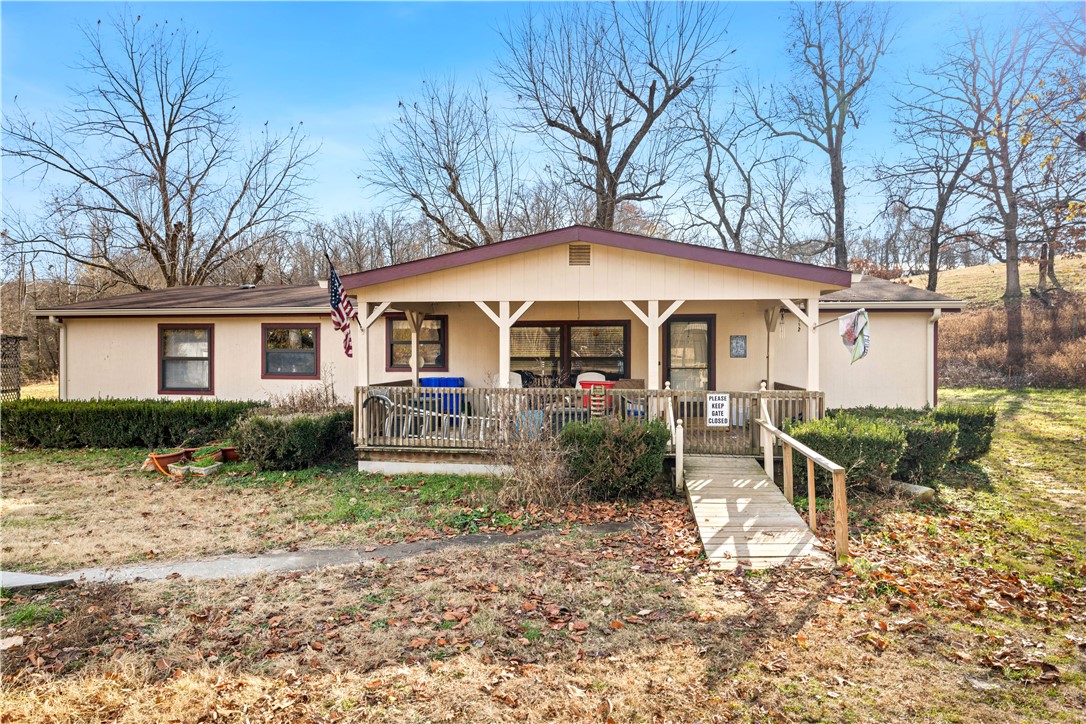 Don't miss this great 3 BR/2.5 BA/1680 SF home on a beautiful 5.53 acres. Home features high ceilings, spacious living room, eat-in kitchen with ample counter and cabinetry space, spacious bedroom, and laundry room. Partially open and wooded property with creek features large 2-car garage, big enough for shop, and multiple outbuildings. Near XNA.