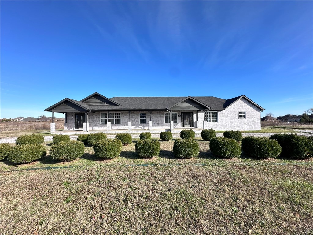 Commercial building and vacant land with approximately 620 linear feet of frontage on N Main St. Easy access to Hwy 72 and Hwy 102. Surrounded by single family developments. Former duplex currently being converted into a single-tenant property.