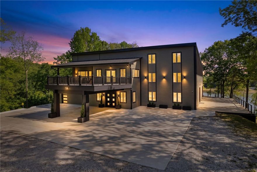 Beaver Lake Reserve, a lakeside family sanctuary on 7 park-like acres w stable. Be the 1st occupant, a complete remodel, ready to move in. In brand-new condition. Private entrance drive, 2 car portico. 2 new kitchens, 6.5 baths, level 5 paint, new roof, new Andersen windows & doors. Great room, 18-ft high Andersen window wall overlooking Beaver Lake. Architectural acoustical ceiling, custom fans in every room. Mezzanine overlooking great room & lake. Decks overlooking your grounds. 300' of easily accessible shoreline. 4 expansive bedrooms, 6.5 designer tile baths, 2 bonus rooms. ADA suite, custom children’s bedroom. Primary bedroom, spa bathroom, walk-in closet. French doors to lakefront deck. Two laundry rooms. Chef’s eat-in kitchen with grand island, waterfall bar seating for 5, custom cabinetry, induction cook tops (2), ovens (2), and sinks (2), adjoining large walk-in pantry. 4 car garage heated/AC, unlimited outdoor parking. 1000 sf of covered secure parking.