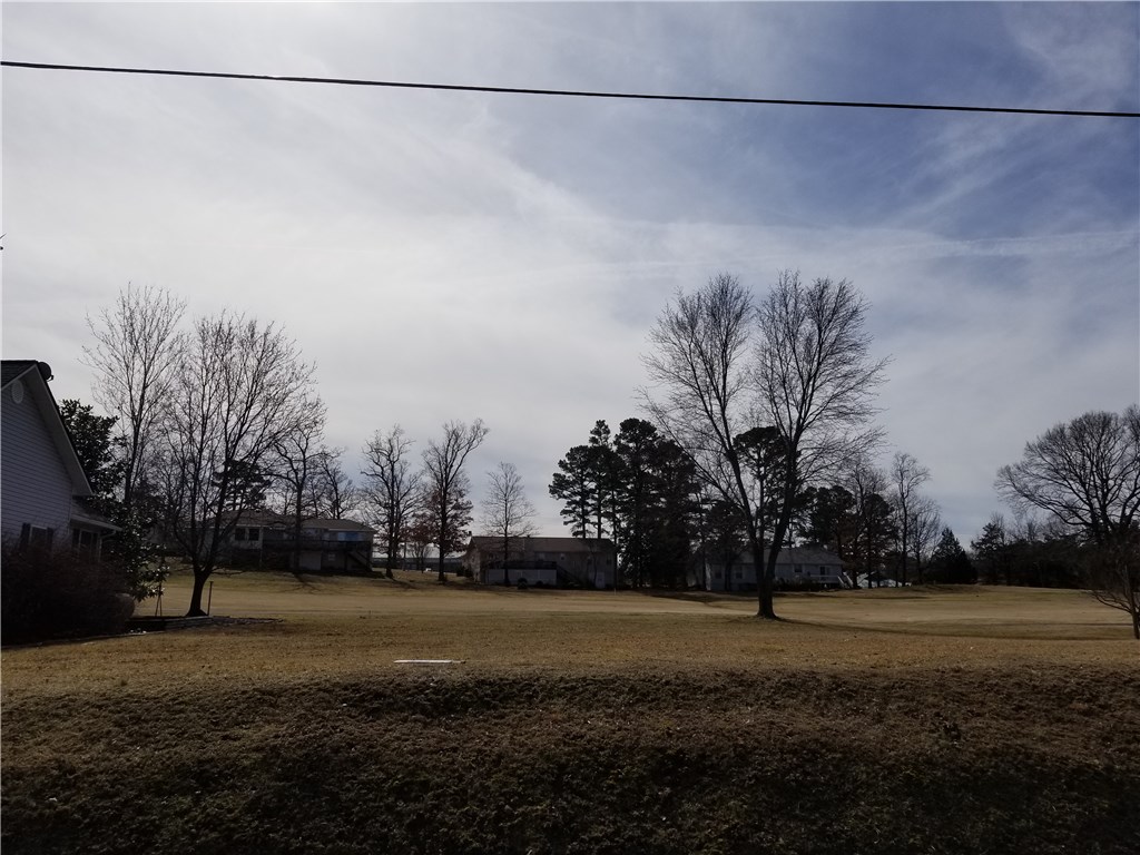 Beautiful level and cleared lot on the 16th fairway. Great central location with access to main highway as well as shopping and entertainment. Walking distance to a fully equipped work out/gym facility. Perfect for building your dream home.