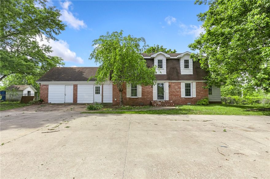Opportunity is knocking at 200 Loftin St! Situated on a full acre, this 4-bedroom, 3.5-bath home offers over 3,300 sq ft and incredible potential.  Built in 1952, the home features classic charm with a brick fireplace, spacious rooms, an attached workshop, storage buildings and a layout ready for your vision. The kitchen includes a pantry and plenty of space to create something truly special. Upstairs bedrooms offer great natural light, there are a couple flex spaces or bonus rooms for hobbies, a home gym, home office space or additional bedrooms.  Outside, the one-acre lot is a standout with mature trees, a fenced backyard with room to spread out, and space to make it your own - plus views of mountains in the distance!   This property is ready for updates and the size, setting, and price point make it a rare find.