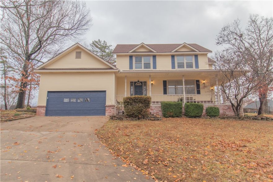 Beautiful lake-area home with stunning fall and winter lake views! This charming 3-bedroom, 2.5-bath property offers warm, inviting living spaces including a cozy fireplace, a bright sunroom, and an expansive wrap-around porch perfect for relaxing outdoors. All bedrooms are conveniently located upstairs, and the home features a spacious laundry room and a large two-level garage. Enjoy the beautifully stone-paved rear patio and the convenience of being just minutes from Prairie Creek Marina. A wonderful retreat you won’t want to miss!