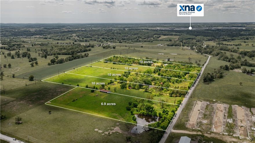 This beautiful 47 +/- acre property is currently divided into 5 parcels, with the potential for reconfiguration through lot line adjustments. After a new survey, each parcel will feature frontage on Phillips Cemetery Road. Most parcels will be approximately 10 acres, with the exception of the northeast parcel, which is 6.9 acres and includes a scenic pond it is also a Seperate MLS #1307926. Important Note: If sold separately, the 6.9-acre northeast parcel must be sold first. Located minutes from key Northwest Arkansas destinations:
12 minutes to the Pinnacle Hills area, 15 minutes to Interstate access, 20 minutes to Downtown Bentonville, and Quick access to XNA Airport. Despite its convenience, the property offers a peaceful, rural atmosphere perfect for those seeking space to enjoy nature, raise chickens, or keep a few pets. Chicken houses across road have been torn down. Whether you're looking for a serene home site or a smart investment opportunity, this land is a rare find in a rapidly growing area.