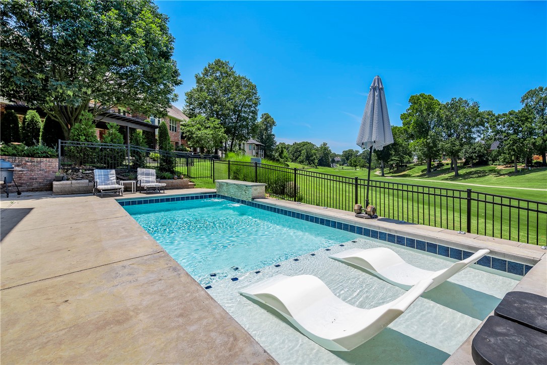 Experience peaceful, carefree living in this beautifully appointed, better-than-new 4-bedroom, 3 full, 1 half bath find nestled in Shadow Valley. Wake up to tranquility in this light, bright, high-quality, custom-built home! Featuring a spacious family room w/fireplace, laundry w/sink, office, formal dining, den, bonus room/gym, walk-in storage/safe-room, oversized 3-car garage, & large bedrooms each connected to a bathroom. Exquisite finish work includes crown molding, beautiful cabinetry, & custom built-ins. The full-featured kitchen boasts stainless steel appliances, quartz counters, over-counter lighting, vented gas range, walk-in pantry, & spacious island/breakfast bar. The roomy master suite w/large bathroom boasts dual vanities, soaker tub, walk-in shower, & spacious walk-in closet! Nestled golf front & among the trees, relax on your patio or composite deck & take in the lush yard that features a heated salt-water pool with water feature, or head to the clubhouse & enjoy one of the many community amenities.