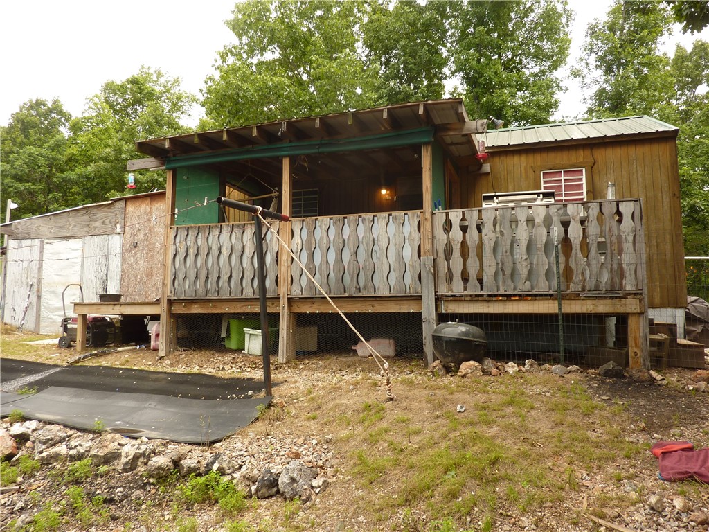 Top of the hill mountain cabin in Western Grove. Would make a perfect hunting lodge. Cabin has everything you will need to have a great weekend or Air BnB. This "tiny home" cabin includes a storm shelter to ensure your safety when needed. Garden boxes, chicken coup, small work shop on 2 acres. Solid and was built in 2017. Great outside views.