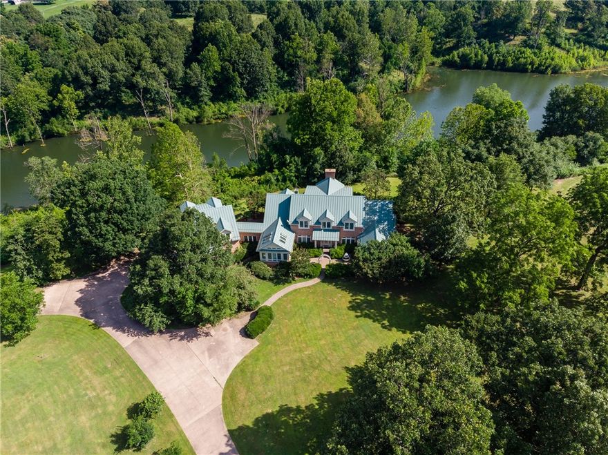 House is undergoing and extensive remodel. Any offers should be as-is based on the construction progress. HUGE PRICE DROP!!! Incredible! Your own semi-private lake on 24+ acres less than a mile from Springdale city limits. Newly remodeled. 6123 sq. ft. Estate Home with additional 1 Bedroom Garage apartment. RV Barn with 2 bedroom Apartment. Fenced very Private. $400,000 Dam and Lake with spillway. Lake stocked with fish. Refrigerator conveys.