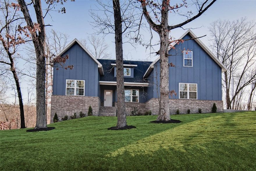 4 bedrooms on the main level and a bonus room with full bath which could also be utilized as a 5th bedroom. The vaulted living room features beautiful beams and elegant wood floors, adding to the home's charm. The kitchen showcases an oversized island, custom cabinets, stainless steel appliances including a gas range, and 3 cm quartz countertops. Retreat to the primary bath, which offers a luxurious large walk-in tile shower, a free-standing tub, and generous closet space. Bentonville schools! Huge covered back patio! Plus, take advantage of $3,500 in buyers closing costs, courtesy of the builder's preferred lender! Bella Vista POA amenities include multiple golf courses, private lakes, miles of hiking & biking trails, recreation centers, swimming pools, tennis & pickleball courts, marinas, and community parks.