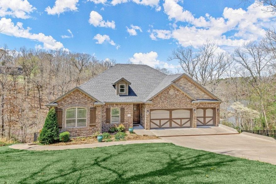 Stunning Bella Vista Lake Home on 2 lots! Built in 2015 this home boasts 2 living and kitchen areas and 4 bedrooms w/ his & her office or add. 5 & 6 bedrooms! Located on Lake Rayburn with a private swim deck, enjoy the private wooded setting from a multi-story deck. Main level living has a bright & spacious open layout w/wood floors throughout. Living room has gas fireplace and open to large eat-in kitchen. Kitchen has gorgeous natural wood cabinets, granite tops, pantry, built-ins, and much more! Master suite has private screened porch access w/lake view, a spa-like bath with massive WIS, whirlpool tub & WIC. 2 guest beds and a guest bath on main level. Downstairs is a huge second living space w/gas fireplace and full kitchen. Media room w/wet bar. 3 guest beds and a guest bath on lower level, plumbed for 2nd laundry/stackable w&d. 3 car garage. Paved path to lake for easy access. 0.83 Acres. A MUST SEE!