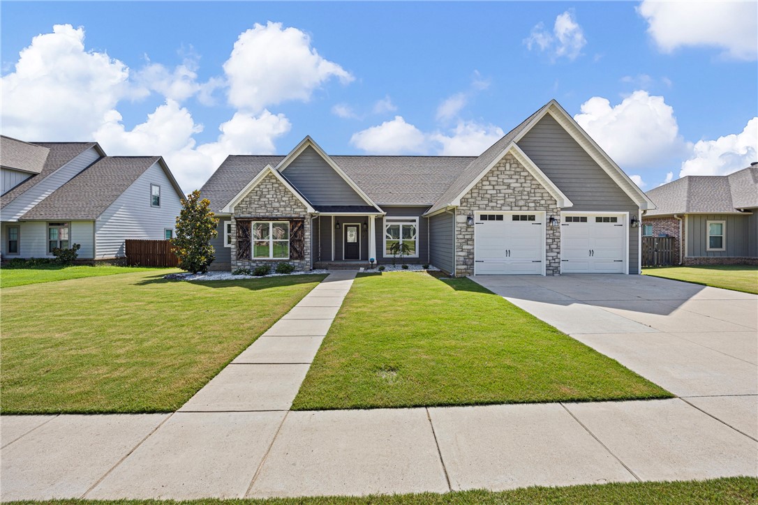 Welcome to 229 Promenade Circle in Russellville! Located in the sought-after Sequoyah Elementary zone, this 4-bedroom, 3-bathroom home features a split floorplan and open-concept design, offering both space and function. Built approximately 8 years ago, it includes large bedrooms, a spacious living room, and an eat-in kitchen ideal for gatherings. The primary suite is a true retreat with two walk-in closets, a tile shower, and a jetted tub. Additional highlights include a fenced backyard, full two-car garage, and a dedicated laundry room. A comfortable and well-designed home in a great location!