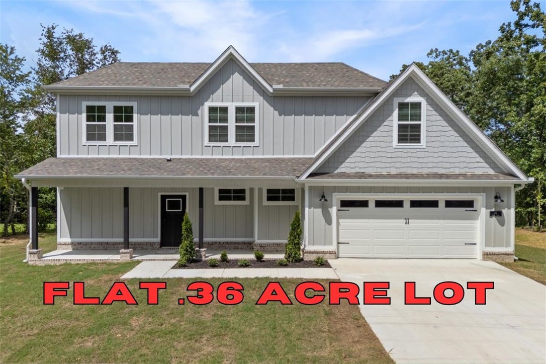 Builder is offering up to $10,000 IN CLOSING COSTS, APPLIANCE PACKAGE OR TOWARDS RATE BUY DOWN with an acceptable offer!! Discover your dream home that is MOVE IN READY and FLAT .36 acre lot. The location couldn't be more perfect as you are right around the corner from Lake Loch Lomond, 5 min to Tiree Park, the interstate, & 10 min to Branchwood Community Center. You'll find open concept living as soon as you walk through the front door with waterfall edge quartz countertops, LVP flooring throughout the downstairs, 10' ceilings, custom cabinetry, a gas range, & a fireplace. Find your private oasis in the primary suite with a large walk in closet, tiled walk in shower, & gorgeous view of the back yard from the bedroom window. With both a covered back deck and front porch you can fully submerge yourself in the surrounding nature. You are sure to fall in love the moment you walk in! Don’t miss the opportunity to own this exceptional home in a vibrant community. Ask your agent about the builder's preferred lender!