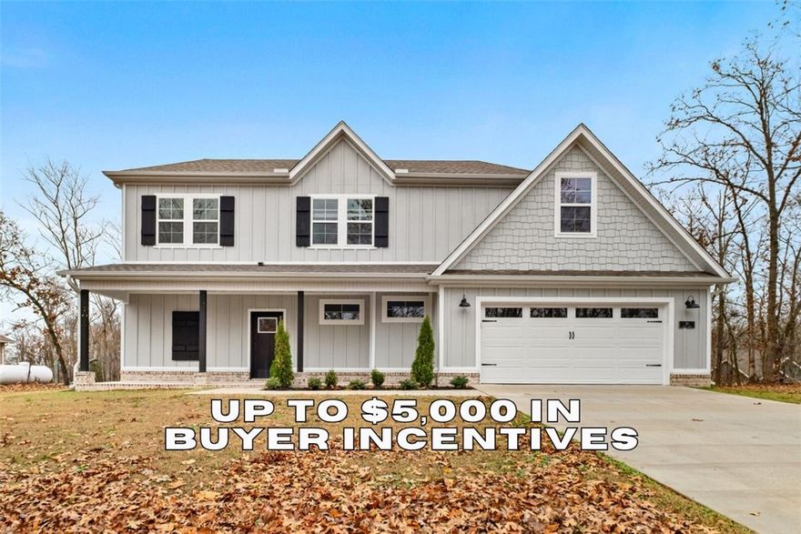 FLAT .36 ACRE LOT!!!! Builder is offering up to $5,000 in closing costs, appliance package or towards interest rate buy down! The location couldn't be more perfect as you are right around the corner from Lake Loch Lomond, 5 min to Tiree Park, the interstate, & 10 min to Branchwood Community Center. You'll find open concept living as soon as you walk through the front door with waterfall edge quartz countertops, LVP flooring throughout the downstairs, 10' ceilings, custom cabinetry, a gas range, & a fireplace. Find your private oasis in the primary suite with a large walk in closet, tiled walk in shower, & gorgeous view of the back yard from the bedroom window. With both a covered back deck and front porch you can fully submerge yourself in the surrounding nature. You are sure to fall in love the moment you walk in! Don’t miss the opportunity to own this exceptional home in a vibrant community. Ask your agent about the builder's preferred lender!