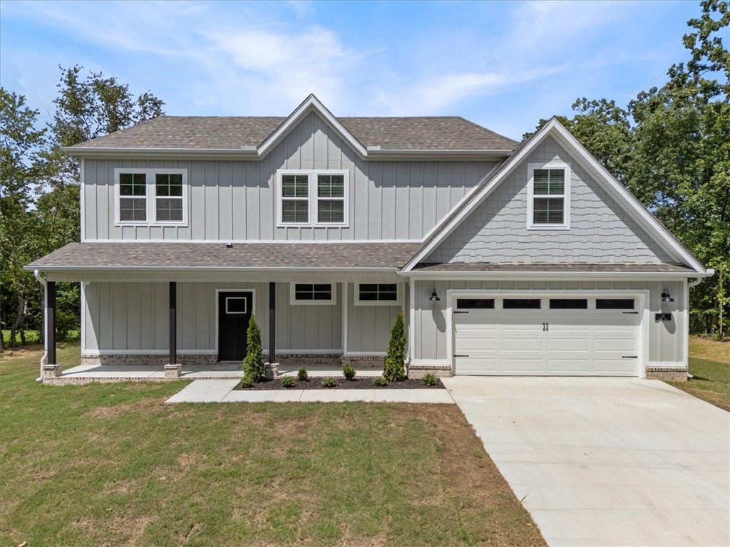 Discover your dream home that is MOVE IN READY and FLAT .36 acre lot. The location couldn't be more perfect as you are right around the corner from Lake Loch Lomond, 5 minutes to Tiree Park, the interstate, & 10 minutes to Branchwood Community Center. You'll find open concept living as soon as you walk though the front door with waterfall edge quartz countertops, LVP flooring throughout the downstairs, 10' ceilings, custom cabinetry, a gas range, & a fireplace. Find your private oasis in the primary suite with a large walk in closet, tiled walk in shower, & gorgeous view of the back yard from the bedroom window. With both a covered back deck and front porch you can fully submerse yourself in the surrounding nature. You are sure to fall in love the moment you walk in! Blinds and gutters included! Donāt miss the opportunity to own this exceptional home in a vibrant community. Ask your agent about the builder's preferred lender!
