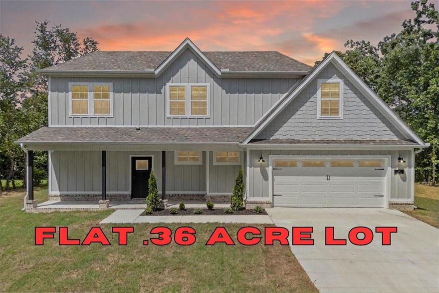 Builder is offering up to $5,000 in closing costs, appliance package or towards interest rate buy down! Discover your dream home that is MOVE IN READY and FLAT .36 acre lot. The location couldn't be more perfect as you are right around the corner from Lake Loch Lomond, 5 min to Tiree Park, the interstate, & 10 min to Branchwood Community Center. You'll find open concept living as soon as you walk through the front door with waterfall edge quartz countertops, LVP flooring throughout the downstairs, 10' ceilings, custom cabinetry, a gas range, & a fireplace. Find your private oasis in the primary suite with a large walk in closet, tiled walk in shower, & gorgeous view of the back yard from the bedroom window. With both a covered back deck and front porch you can fully submerge yourself in the surrounding nature. You are sure to fall in love the moment you walk in! Don’t miss the opportunity to own this exceptional home in a vibrant community. Ask your agent about the builder's preferred lender!