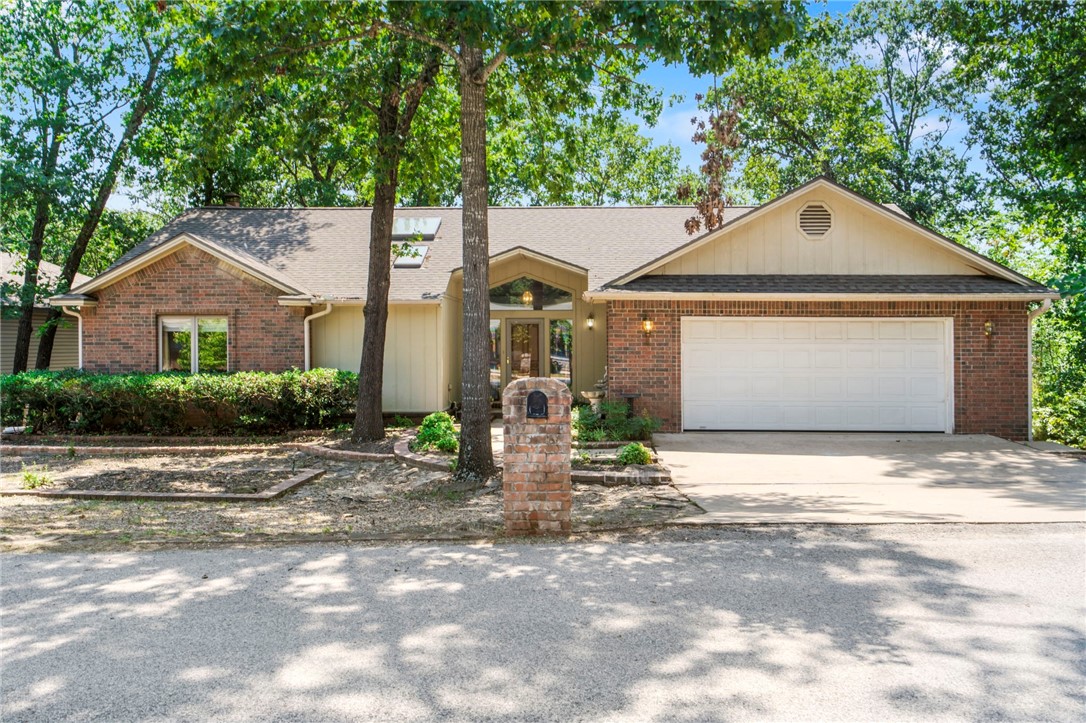 Custom 2 bed, 2.5 bath home with all main living on one level and a thoughtful split floor plan. Filled with natural light and built-in storage throughout. Large sunroom and open porch overlook a private yard. Bonus room and half bath downstairs accessible through the garage or exterior offer great flex space for a shop, gym, or studio. Prime location just minutes from Hwy 71 with access to Bella Vista POA amenities including lakes, golf, trails, pools, and more.
