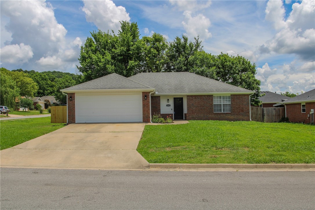 Adorable Fayetteville Gem with Modern Comforts Discover this charming 3-bedroom, 2-bathroom home, ideally situated on a spacious corner lot in a highly sought-after Fayetteville location. Enjoy unparalleled convenience with quick access to MLK & Rupple Road, making your commute to the University of Arkansas campus a breeze. This completely remodeled home offers the perfect blend of modern updates & cozy charm. Step inside to a welcoming living room featuring a warm fireplace, perfect for relaxing evenings. Each bedroom boasts generous closet space, providing ample storage.
Beyond the interior, you'll find a two-car garage & a nicely fenced backyard, ideal for privacy & play. The highlight of the outdoor space is a large covered back porch, perfect for entertaining guests or enjoying your morning coffee. Plus, a brand new, energy-efficient HVAC system ensures year-round comfort & lower utility bills. Don't miss the opportunity to make this delightful property yours!