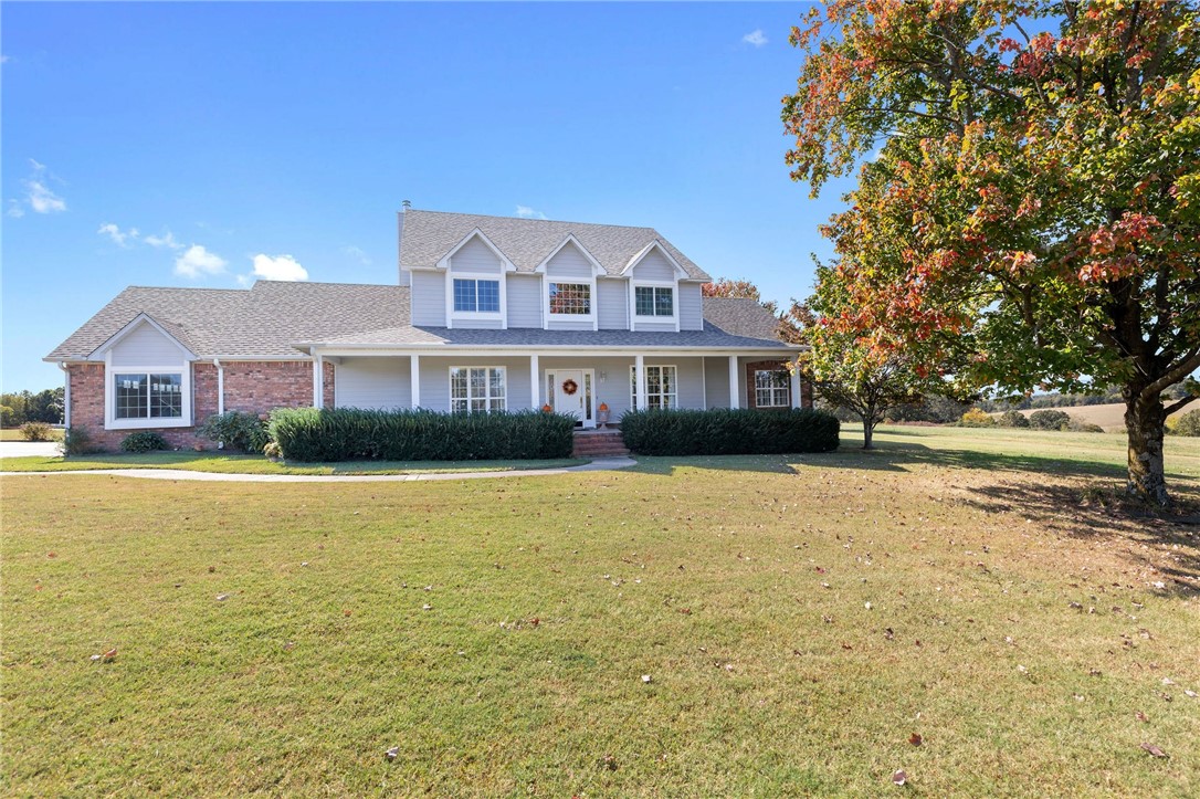 Absolutely amazing home on 20 acres! With over 3,000 square feet in the main house with 5 bedrooms, 2 full baths, and 2 half baths, plus an additional 450 square feet in the detached garage/workshop, it's definitely spacious. And don't even get me started on the oversized two-car attached garage, the detached two-car garage with a workshop(32' x42'), and semi-finished bonus room for plenty of storage space - talk about a dream setup! Just imagine yourself stepping into the beautiful home with hardwood floors, enjoying meals in the formal dining room, cozying up by the fireplace in the spacious living room, and whipping up delicious meals in the lovely kitchen. And let's not forget about that covered back porch - the perfect spot to sip my morning coffee while soaking in those incredible distance views. This home truly sounds like a slice of paradise! Main Level 1,831 sq ft, Upstairs 1,365.sq ft