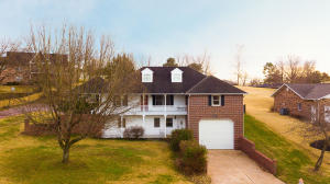 Beautiful Home on the 15th green with a touch of Southern Charm!! This 5 bedroom, 3 bath home backs up to the golf course and has many wonderful features some of which include wooden beams and a gas fireplace in the living room, dining plus breakfast area, tray ceilings in the master bedroom, large upstairs bonus room, good size den in the basement, 2 car garage upstairs and RV garage on the lower level and a privacy fenced backyard. Relax at the end of the day on the Pergola covered back patio while watching the golfers showing off their skills. Unless you are enjoying the 4 person hot tub under the gazebo! Did I mention it was on the 15th Green!!!!