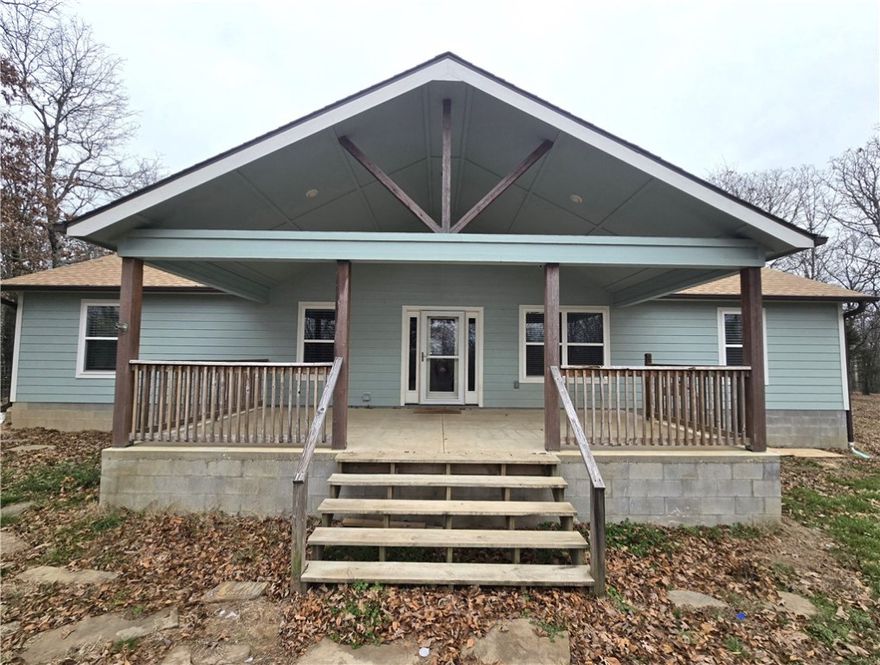 Welcome to Hope Mountain! This 12.75 AC property is gated & secured. This 2,100 SF home has 3 Primary BR's, 3 full BA's & 3 Walk in closets, plus a half bath. Complete with granite countertops, top of the line matching appliances, & a pellet stove for those cozy nights.  Energy Efficient dual fuel furnace & 2 propane tanks that are owned. Also featuring a large front porch, video surveillance, as well as an 800 SF heated/cooled 2 car garage with 12 person above ground F5 rated tornado shelter. Whole home auto backup generator. Property also features a 1,500 SF red iron heated/cooled shop with full restroom. 2,400 SF fully enclosed pole barn. Step down the mountain to your beautiful cabin. New in 2025, the cabin is 16'x40' & includes all appliances w/t a state-of-the-art washer & dryer. Cabin also features a deck & its own utility services. There are 7 additional spots available for building around the property. Lincoln lake is excellent for fishing and less than .5 mile down the road.