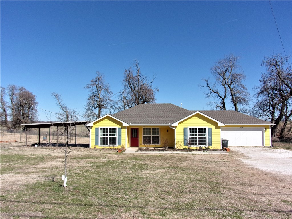 Hard to find a home with land this close to town. One Owner home built in 2017. Split Bedrooms. Covered front porch. Granite countertops, pantry, gas log fireplace, large covered patio. Great home for a family with room for some livestock.