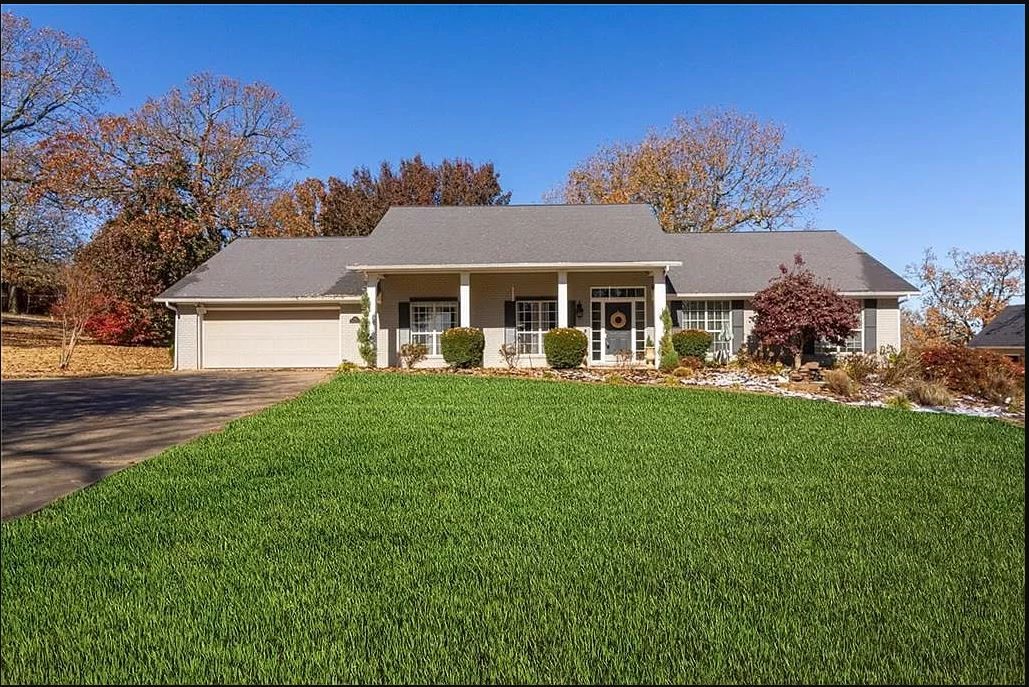 This spacious ranch home sits atop a hill overlooking Springdale's business community to one side and rural fields on the other. Offers sweeping seasonal views of the countryside. Boasts an abundance of flowering plants and trees. Fenced in back patio has two gazebos and wired with electric for entertaining. Two master bedrooms. Property has matching storage building with attic. Working water feature. Two skylights. Home is nestled in a cul-de-sac lined with huge mature trees. Updates include: Three Large bay windows, bamboo flooring, soft stone fireplace front and mantel, granite kitchen countertops. A hidden gem in a beautiful kept neighborhood.