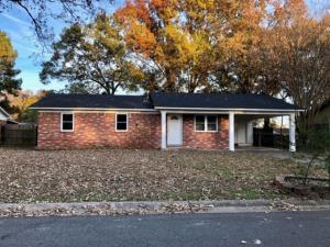 Clean and updated brick home in town! Huge fenced in backyard with small storage building, cement patio, and 2 big oak trees Carport with storage closet.NEW in 2018: charcoal-colored roof made of architectural shingles, gas water heater, beautiful oak hardwood flooring in living room and all bedrooms (no carpet in the house), farmhouse style light fixture in kitchen, garbage disposal.NEW in 2012: windows, tile floors in laundry room, kitchen, and bathrooms, cabinets, granite counter tops, tiled shower, sinks, faucets, stainless-steel appliances, porch columns, lighting (fans and lights), doors, rebuilt closets, flower beds, central heat and air.